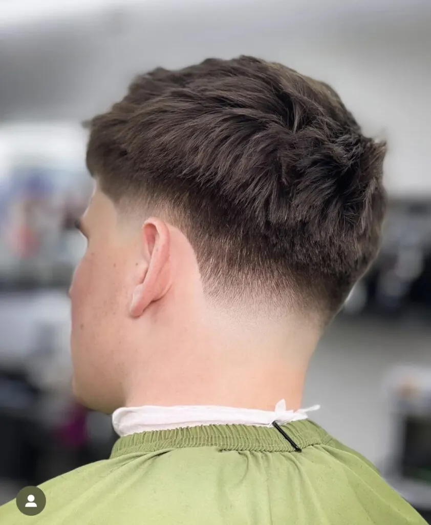 Cuts On Lime barber finishing a haircut in Lexington